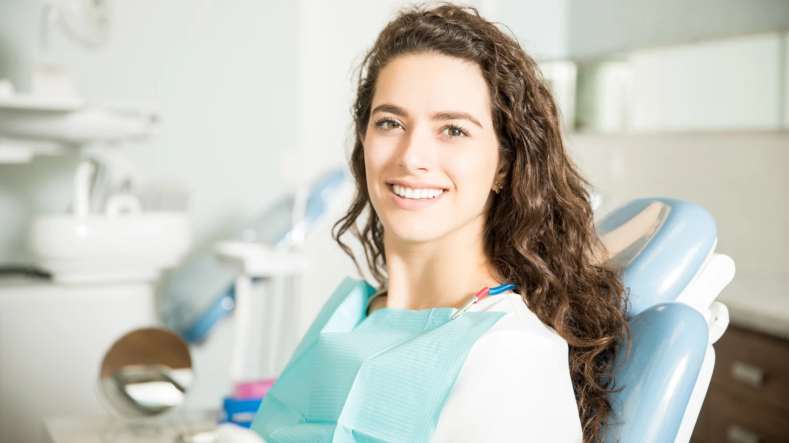 A smiling patient in the dental chair during a visit at Broadview Dental Clinic in Riverdale